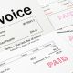 Invoice with Paid Stamp - three invoices with paid stamped on them. All details are imaginary.