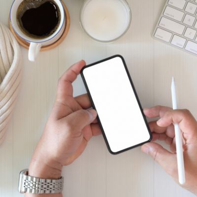 top-view-man-using-mobile-smart-phone-workplace_67155-1565